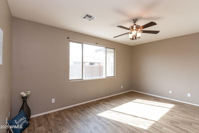 unfurnished room featuring ceiling fan and light hardwood / wood-style floors