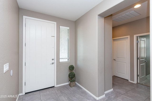 view of tiled foyer entrance