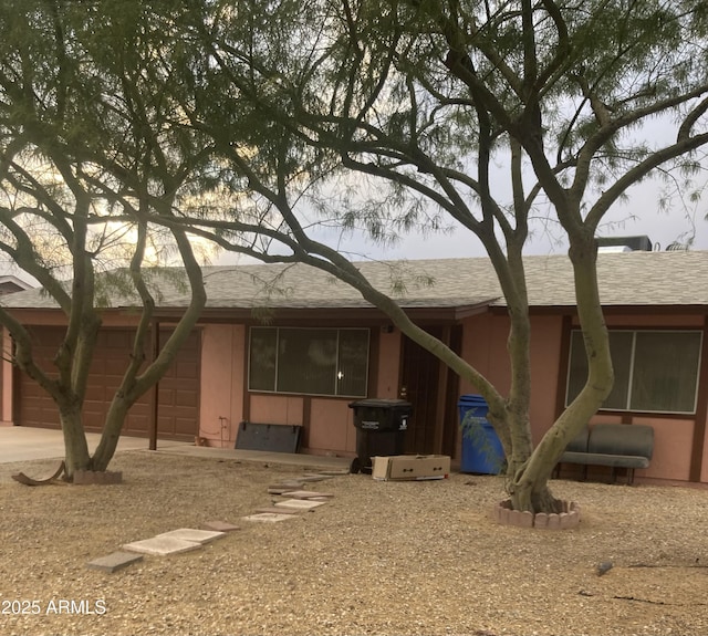 view of front of house with a garage and driveway