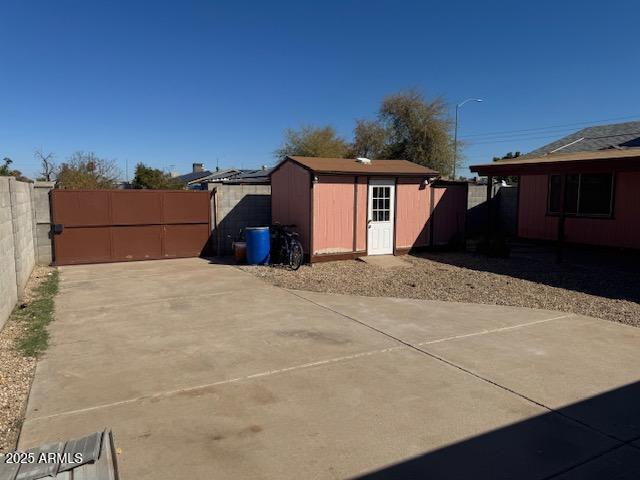 view of shed featuring a fenced backyard