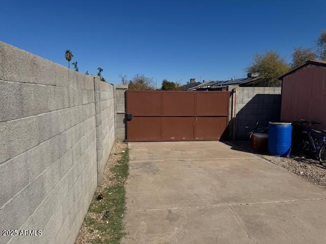 exterior space with a gate and fence