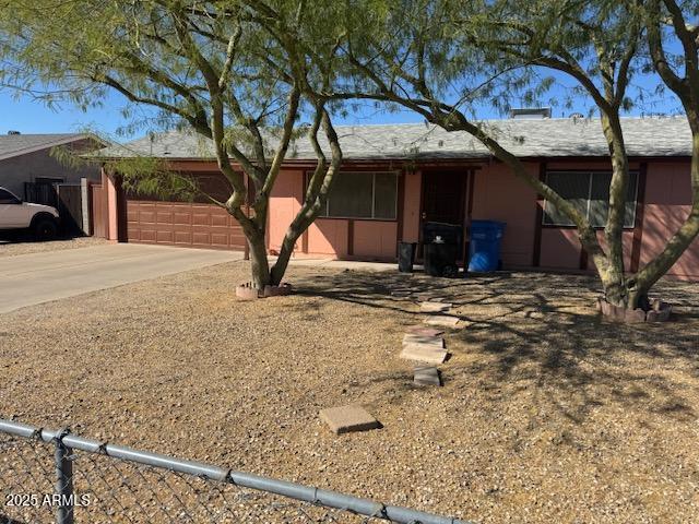 view of front of house featuring a garage and concrete driveway