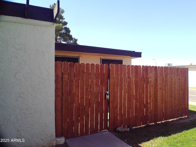 view of gate featuring fence