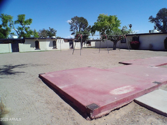 view of yard featuring playground community