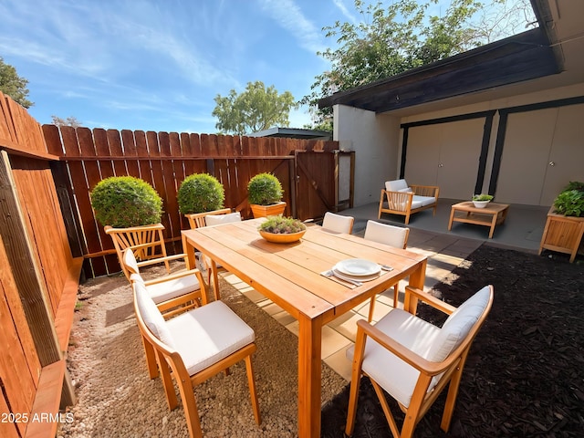 720 S Dobson Rd Unit 95, Mesa, AZ 85202 - view of patio / terrace featuring outdoor dining area and a gate