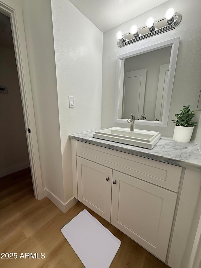 720 S Dobson Rd Unit 95, Mesa, AZ 85202 - bathroom featuring wood finished floors, vanity, and baseboards