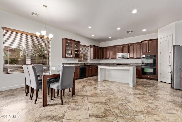 kitchen featuring recessed lighting, visible vents, a notable chandelier, and black appliances