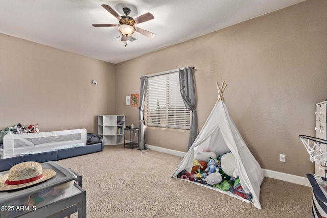 bedroom with baseboards, carpet floors, and ceiling fan