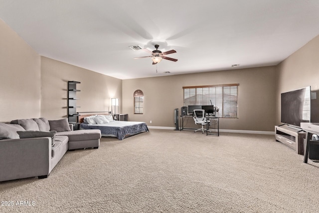 living area featuring visible vents, baseboards, ceiling fan, and carpet floors