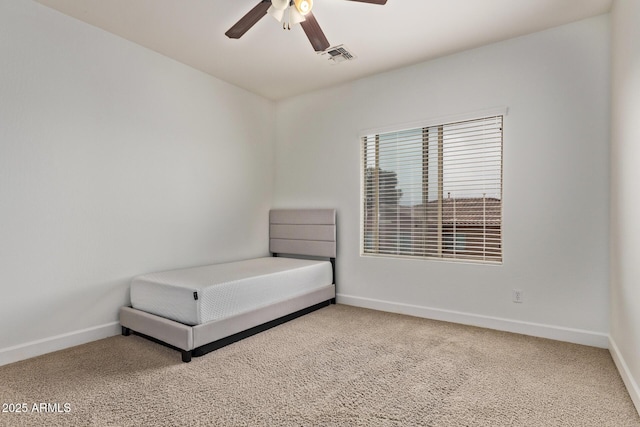 unfurnished bedroom with visible vents, ceiling fan, baseboards, and carpet floors