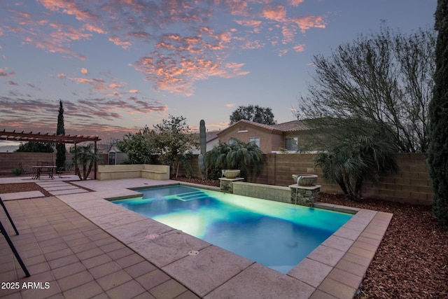 pool at dusk with a patio area, a fenced in pool, a pergola, and a fenced backyard