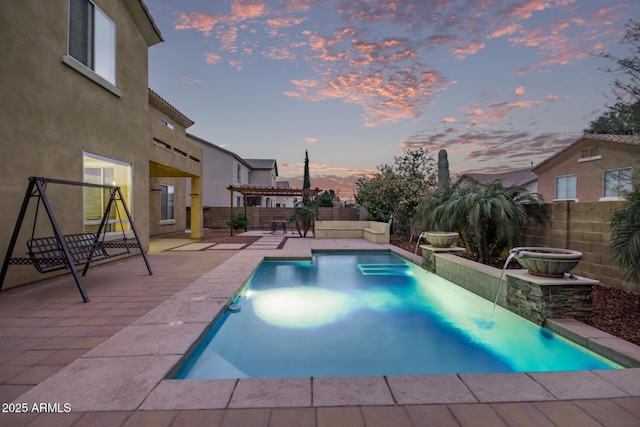 pool at dusk with a patio, a fenced in pool, a fenced backyard, and a pergola