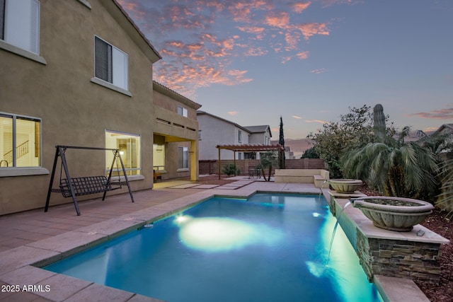 view of swimming pool with a fenced in pool, a patio, and a pergola