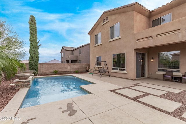 view of pool featuring a fenced in pool, a fenced backyard, and a patio area