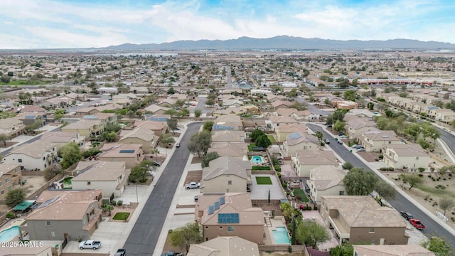 drone / aerial view with a residential view and a mountain view