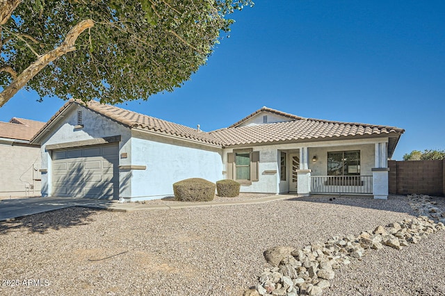 view of front of house featuring a porch and a garage