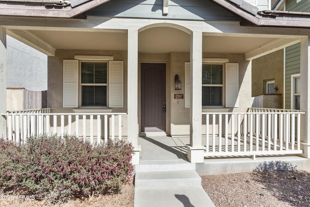 doorway to property featuring covered porch