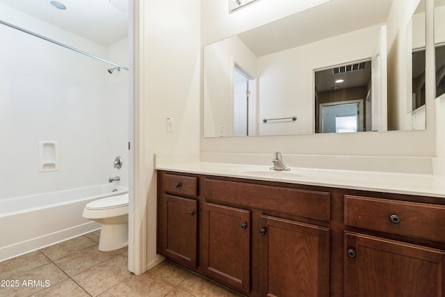 bathroom with vanity, toilet, tile patterned flooring, visible vents, and bathing tub / shower combination