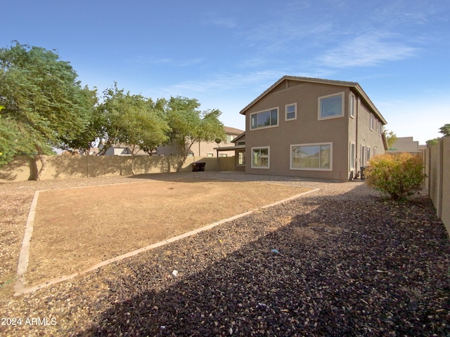 rear view of house featuring a patio