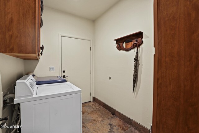 laundry area with cabinets and separate washer and dryer