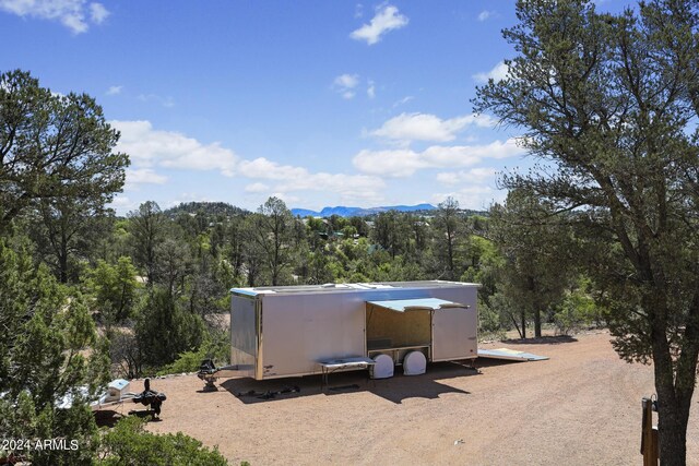 view of outdoor structure featuring a mountain view