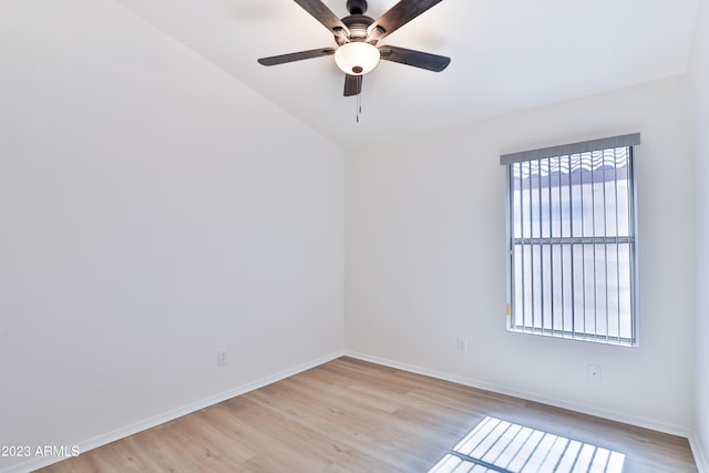 unfurnished room with ceiling fan, light hardwood / wood-style flooring, and vaulted ceiling