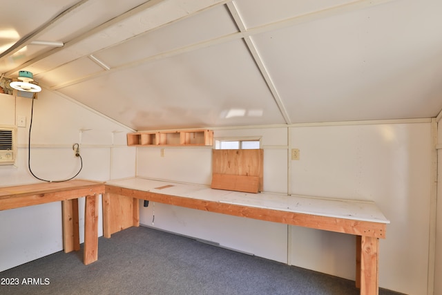 basement featuring dark colored carpet