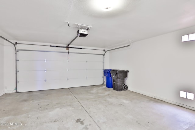 garage featuring a garage door opener