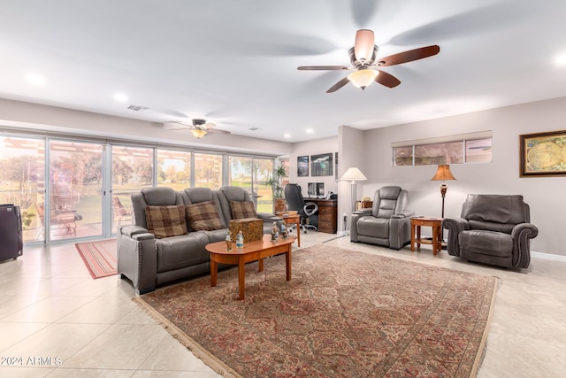 tiled living room with ceiling fan