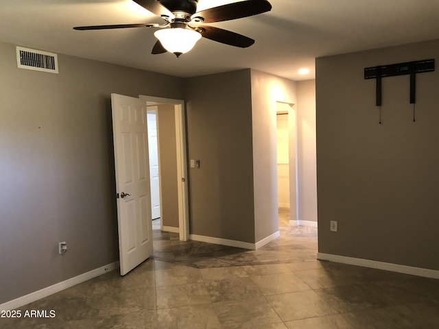 empty room featuring ceiling fan