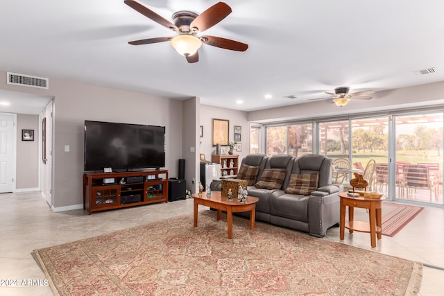 living room featuring ceiling fan and light tile patterned floors