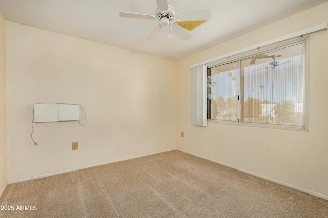 empty room with ceiling fan and carpet floors