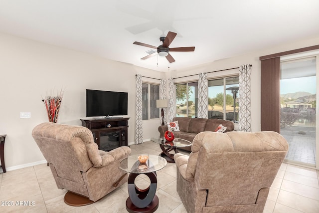 tiled living room featuring ceiling fan