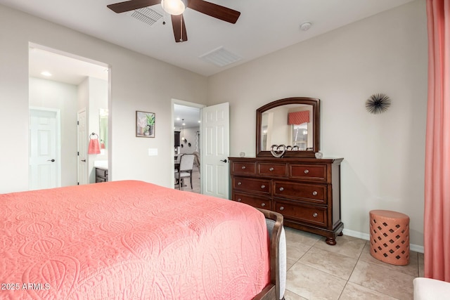 bedroom with light tile patterned floors, ensuite bath, and ceiling fan