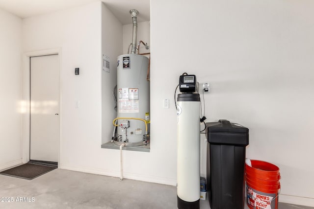 utility room featuring water heater