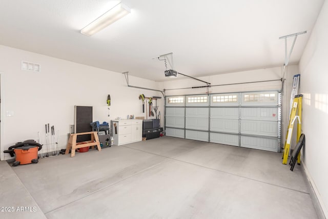 garage featuring a garage door opener