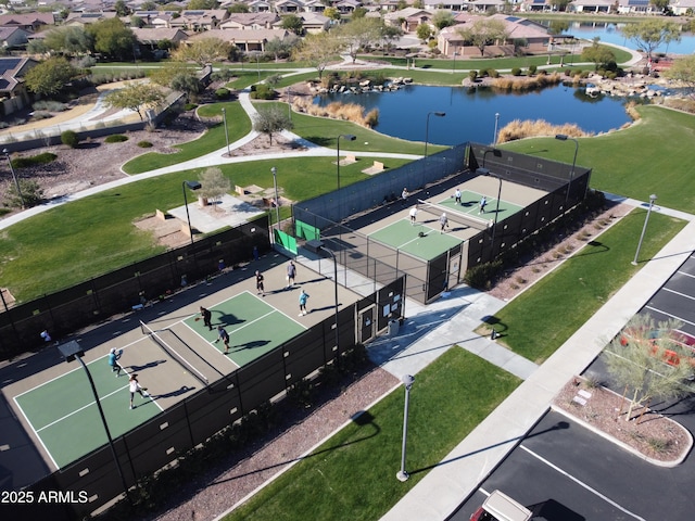 birds eye view of property with a water view