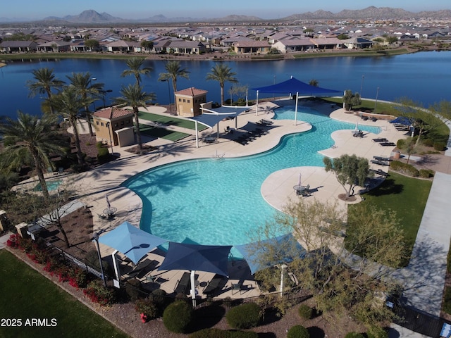 view of pool featuring a patio and a water and mountain view