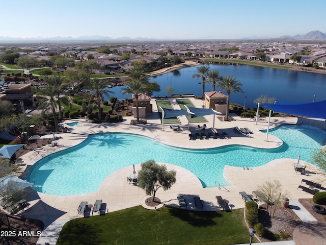 view of swimming pool featuring a patio area and a water and mountain view