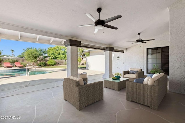 view of patio featuring a fenced in pool, an outdoor living space, and ceiling fan