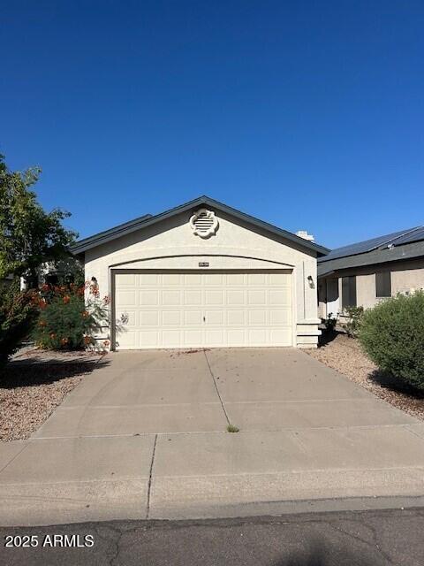 15088 N 85th Dr, Peoria, AZ 85381 - single story home with driveway and a garage