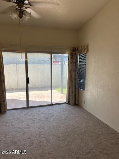 15088 N 85th Dr, Peoria, AZ 85381 - carpeted spare room with healthy amount of natural light and a ceiling fan