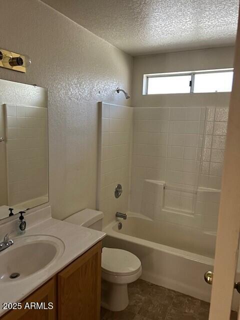 15088 N 85th Dr, Peoria, AZ 85381 - bathroom with vanity, bathing tub / shower combination, a textured ceiling, and a textured wall