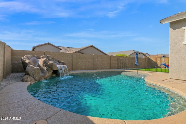 view of pool with pool water feature