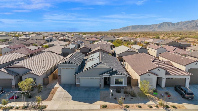 birds eye view of property with a mountain view