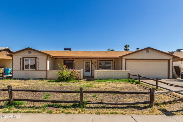 single story home featuring a garage