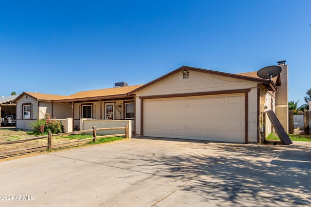 ranch-style house featuring a garage