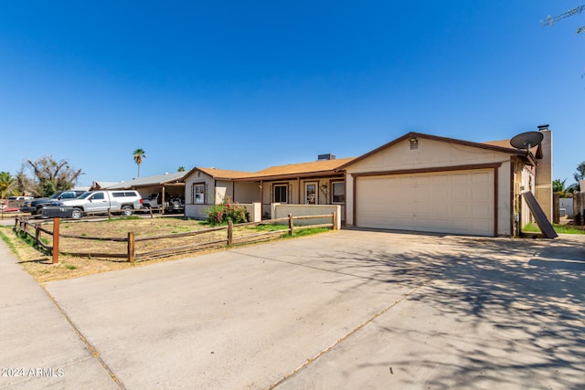 ranch-style house featuring a garage