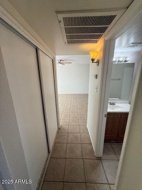 4625 W Thomas Rd Unit 48, Phoenix, AZ 85031 - hall with tile patterned flooring and a sink