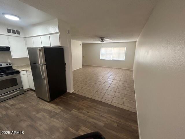 4625 W Thomas Rd Unit 48, Phoenix, AZ 85031 - kitchen with appliances with stainless steel finishes, a ceiling fan, light countertops, extractor fan, and white cabinets